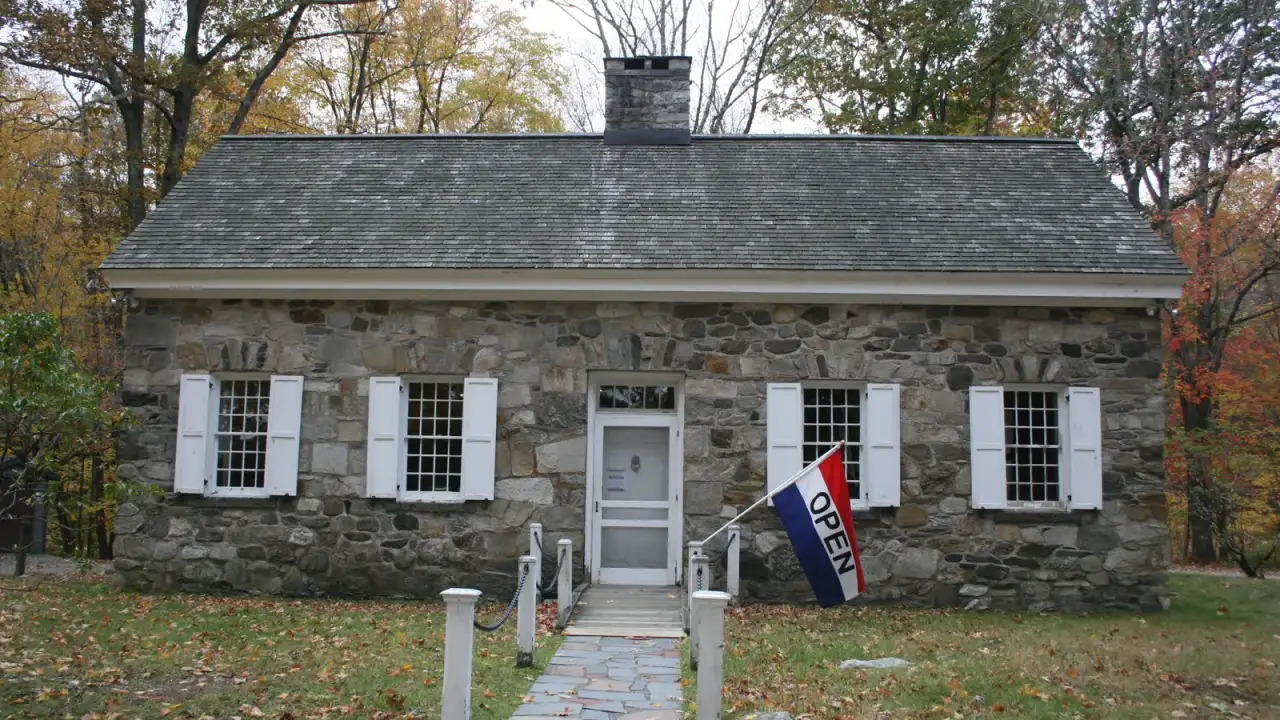 Fieldstone museum building with white shutters at Putnam Memorial State Park in Redding, Connecticut