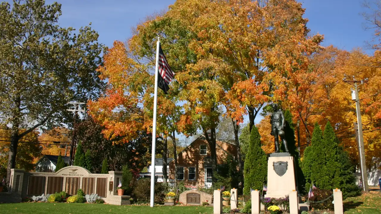 The Westport World War II memorial and doughboy statue on the town green in autumn, Westport, Connecticut